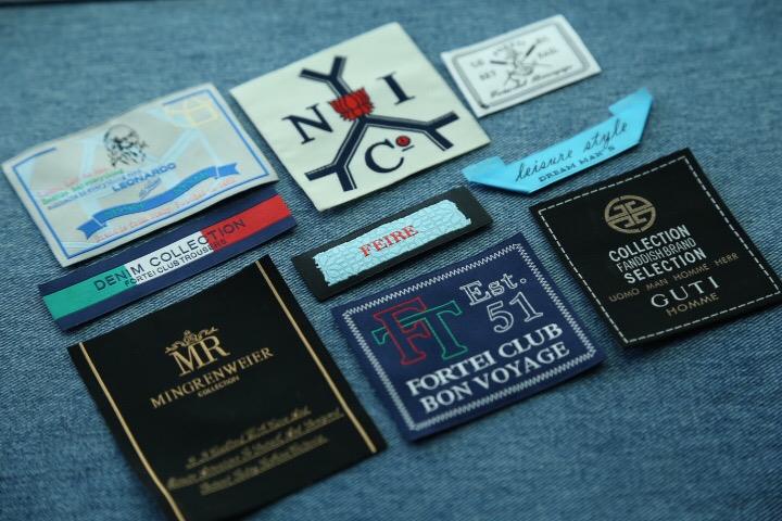 Guangzhou customized polyester denim jacket flag label woven jeans label
