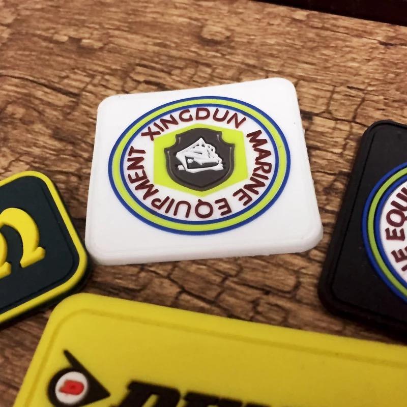 China Wholesale Custom 3D Brand Name Logo Embossed Garment Soft PVC Rubber Patch Labels for Clothing